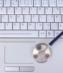 Picture of a computer keyboard with a stethoscope on top